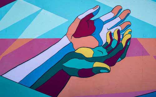 Artistic painting of hands in multi color
