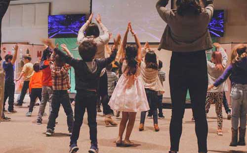 Kids dancing in a classroom