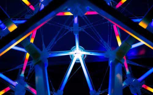 Symetrical metal beam structure with lights and colors