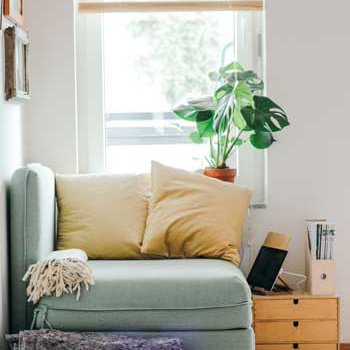 One seat sofa by a window